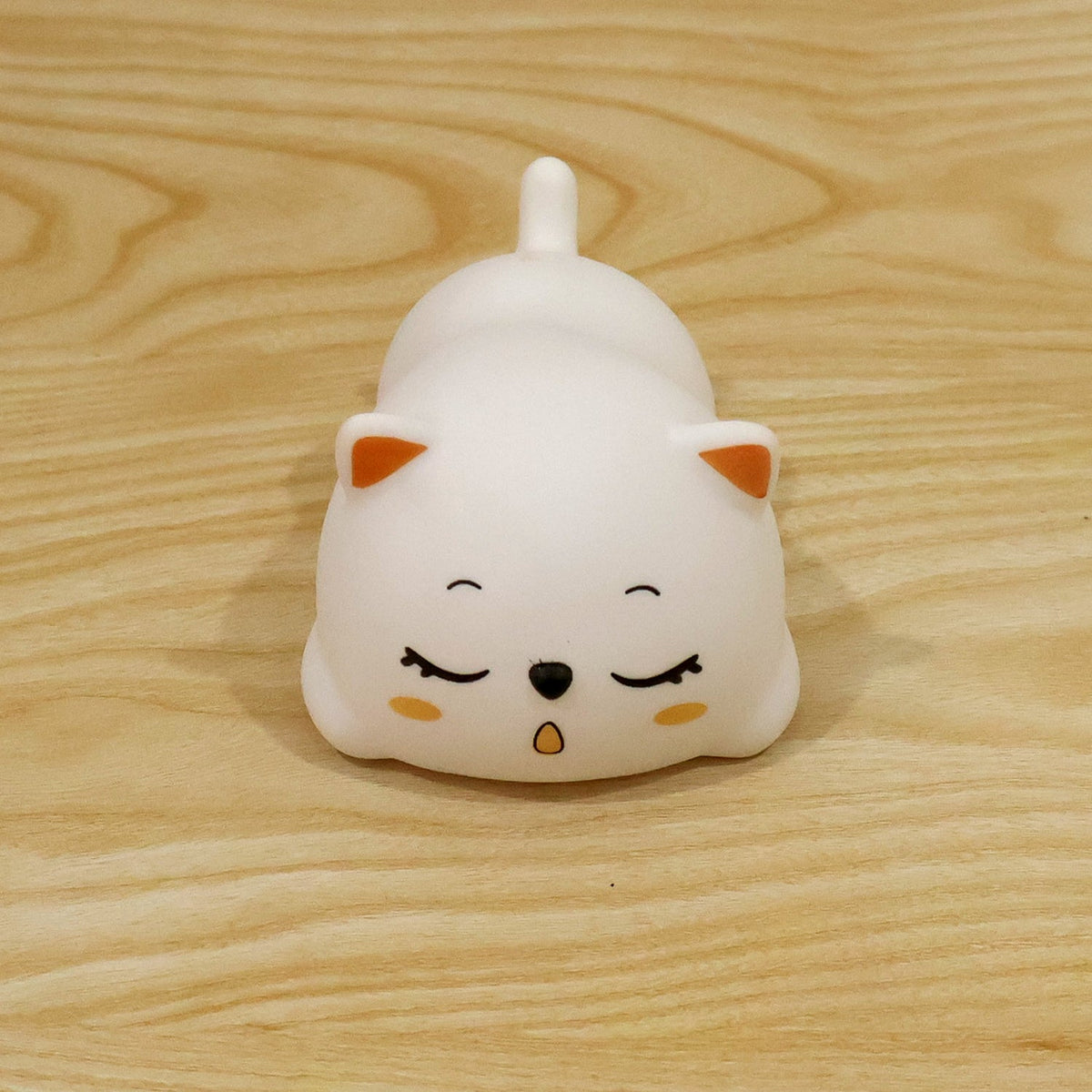 Sleeping cat night light used in a bedroom setting