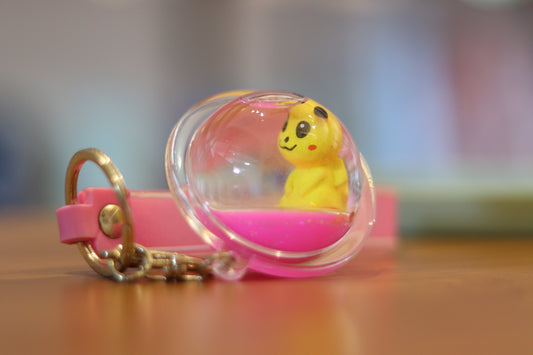 Pikachu Liquid Ball Keychain – Cute Transparent Sphere Charm with Pink Floating Liquid | Acrylic Pokémon Key Ring with Strap for Bags & Gifts | Onebest ⚡💛