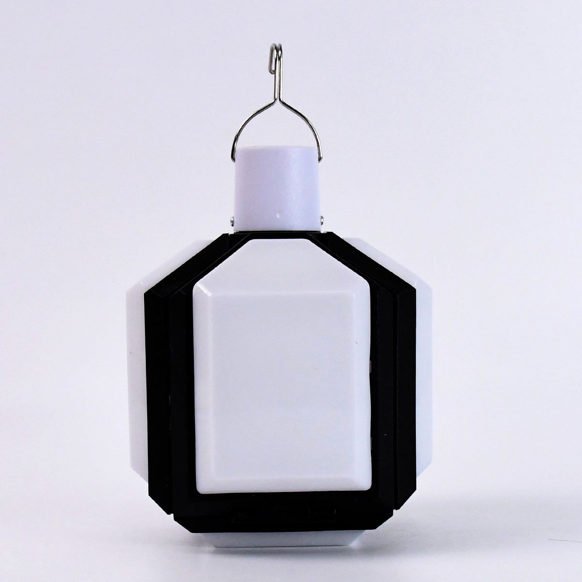 Compact white and black foldable LED lantern with a metal hook on a plain white background.