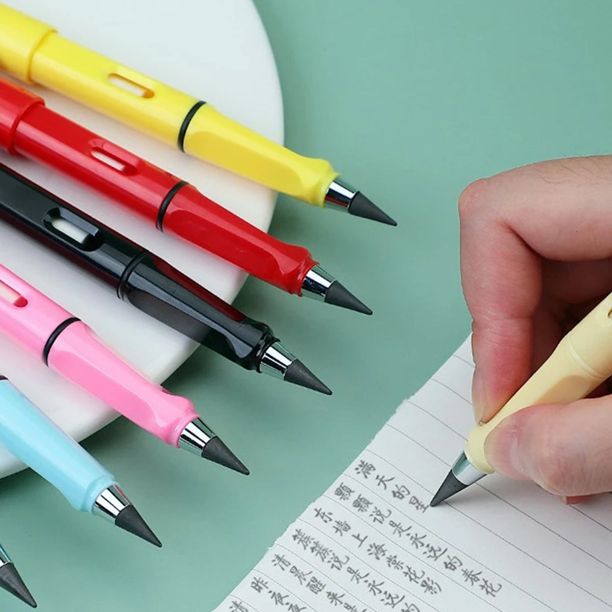 A hand holds a light yellow inkless pencil with a replaceable eraser, writing on paper.
