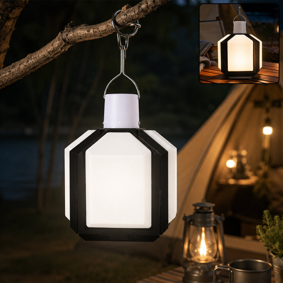 Illuminated white and black foldable LED lantern hanging from a tree branch at night, with a tent in the background.