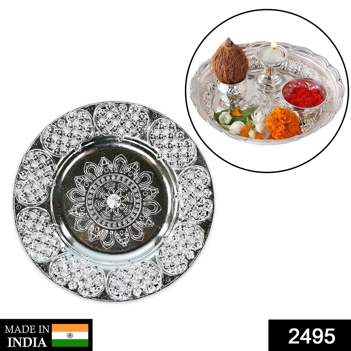 A silver-colored plastic pooja thali with an embossed design, featuring an inset of a decorated thali with coconut, lamp,