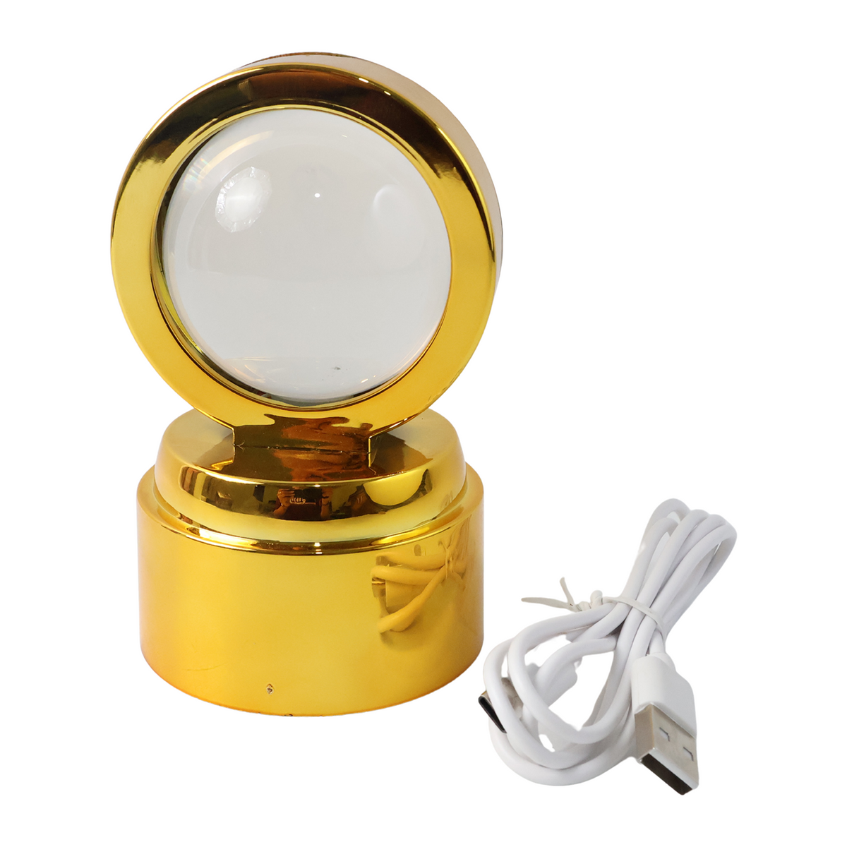 A golden stand with a clear crystal ball, unlit, shown next to a coiled white USB charging cable on a white background.