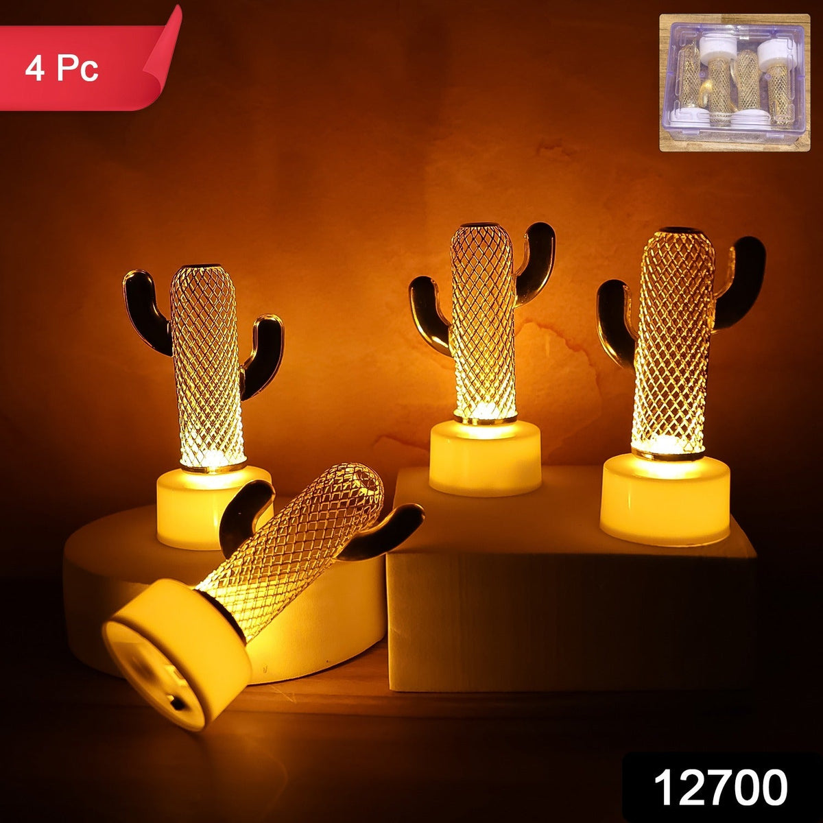 Four cactus-shaped LED lights glow warmly on a beige surface, with a small box of lights in the top right corner.