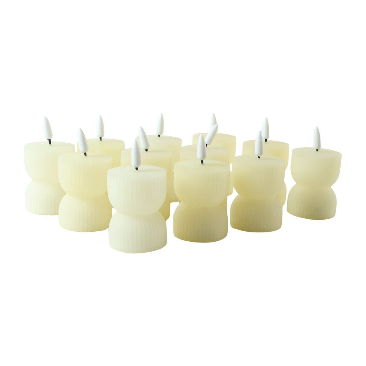 A group of twelve cream ribbed flameless candles with white wicks are scattered on a clean white background.