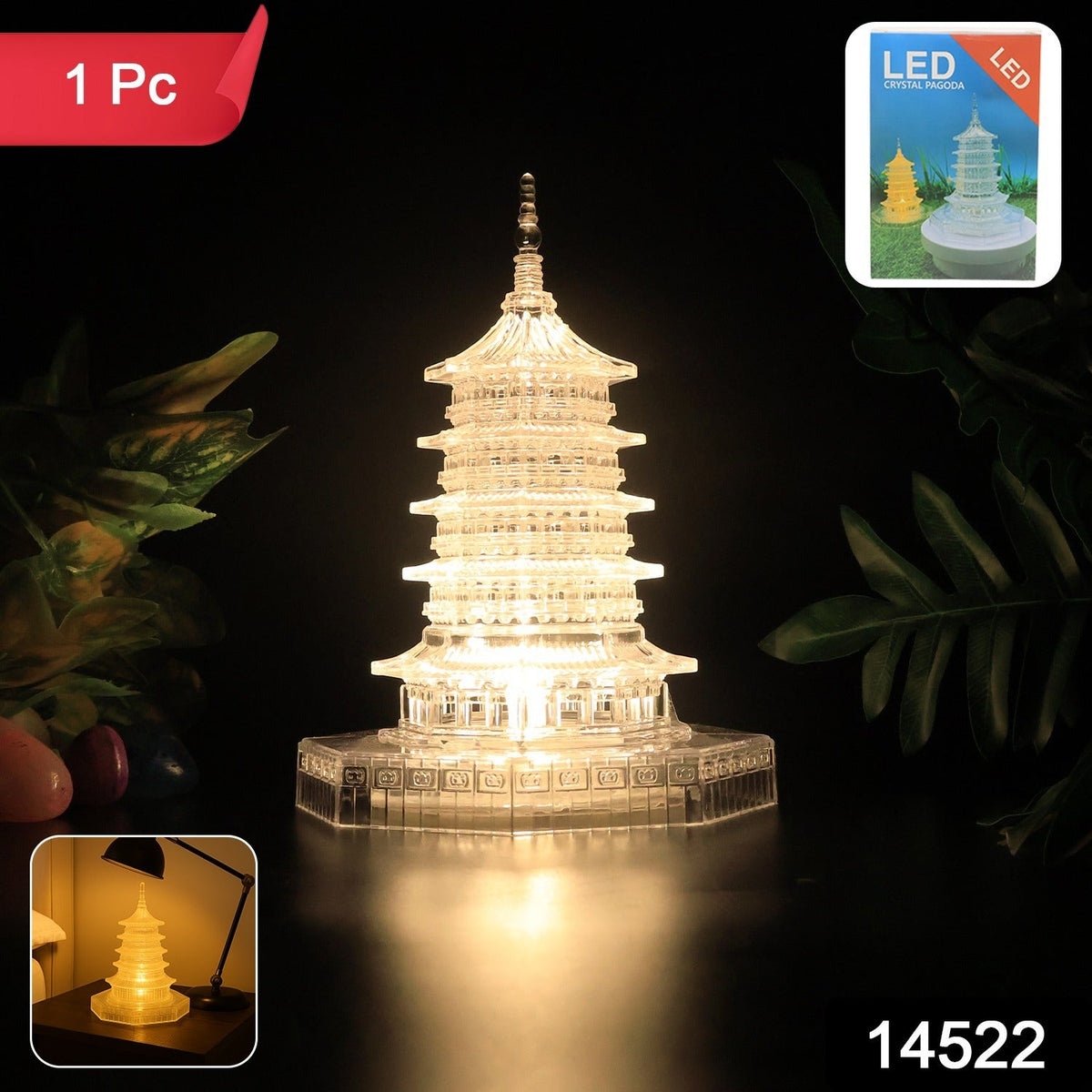 A clear, illuminated LED crystal pagoda light on a dark surface with green foliage, a red '1 Pc' label, and product number