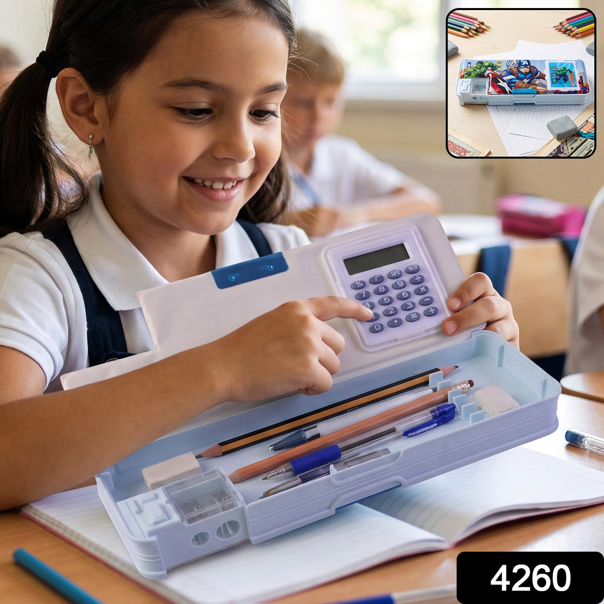 A light blue pencil box featuring Avengers characters, a calculator, and a sharpener, displayed on a wooden surface.